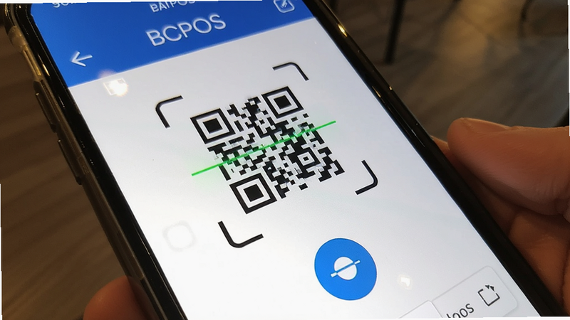 BCPOS app close-up shot of QR code scanning interface, bright screen, clear UI elements, realistic phone camera view, focus on the scan button