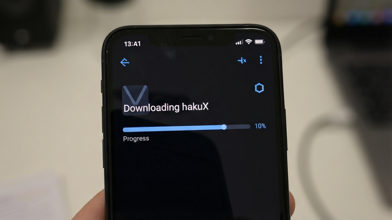 A phone screen showing an APK file download progress bar. Text