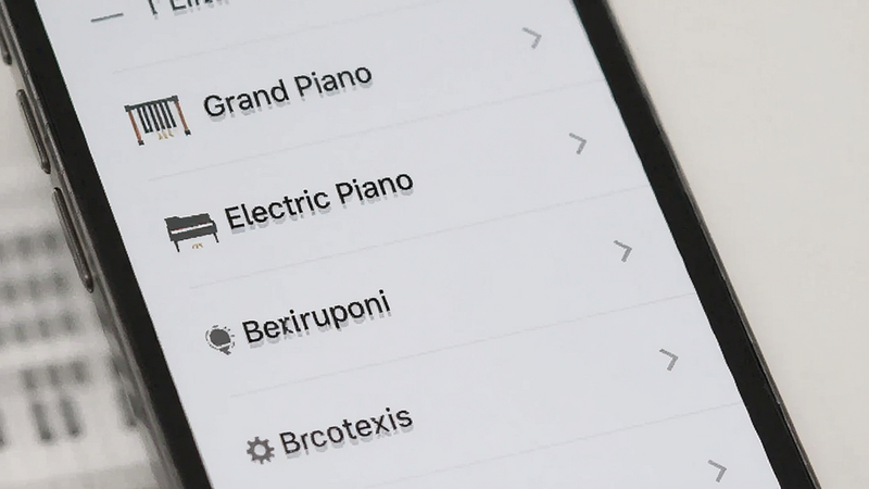 手机界面展示音色选择列表,列表中包含“Grand Piano”、“Electric Piano”等英文标签,界面设计简洁扁平化,背景为浅灰色,文字清晰易读,布局整齐,现代UI设计风格