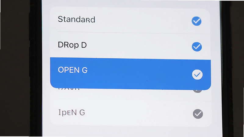 主体为手机设置界面,列表中显示“Standard”、“Drop D”、“Open G”等选项,当前选中项高亮显示,背景为白色简洁卡片式布局,文字清晰,风格简约,细节展示勾选图标,画质高清,干净无多余元素